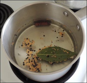 The pickling liquid simmering on the stove.